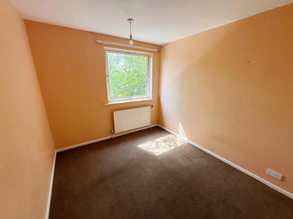 Lot: 1 - FIRST AND SECOND FLOOR THREE-BEDROOM MAISONETTE - Bedroom 1 with painted walls and dark carpet